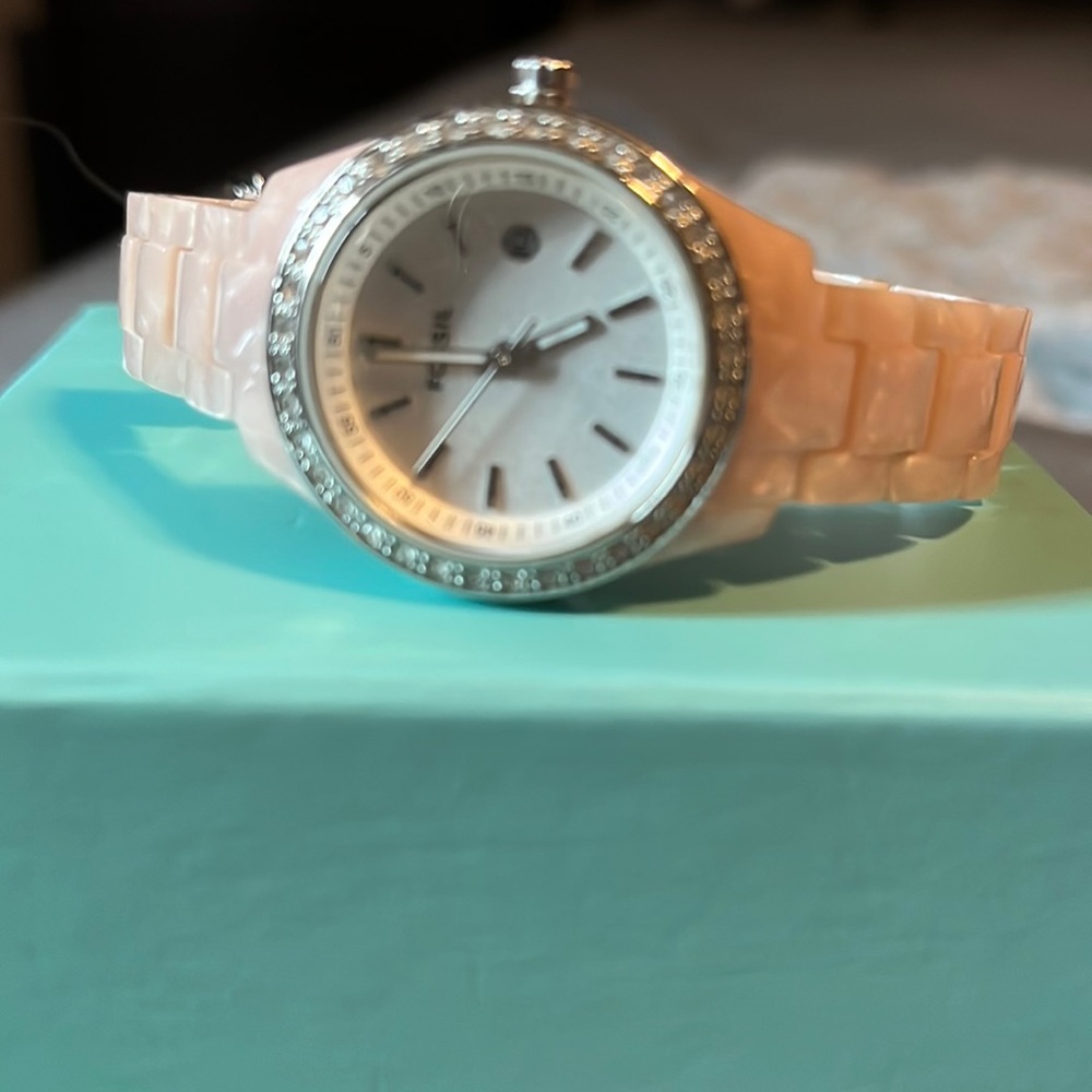 Fossil watch with gemstones.